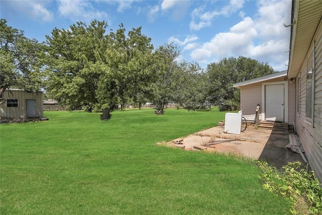 105 E E Walk, Canute, OK 73626 - view of green lawn with a patio