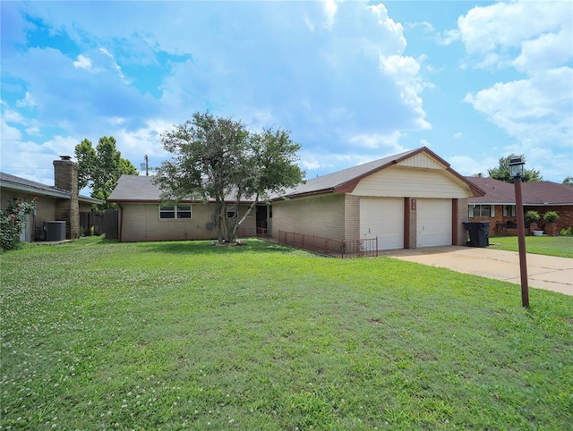 516 SW 63rd Ter, Oklahoma City, OK 73139 - ranch-style home with a front yard, brick siding, and concrete driveway