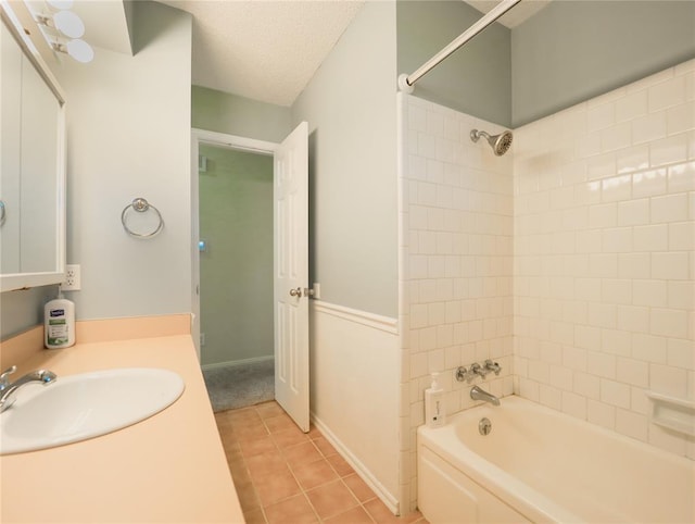 516 SW 63rd Ter, Oklahoma City, OK 73139 - bathroom with tub / shower combination, tile patterned flooring, vanity, and a textured ceiling