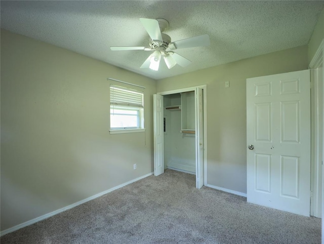 516 SW 63rd Ter, Oklahoma City, OK 73139 - unfurnished bedroom with carpet flooring, a textured ceiling, a closet, and a ceiling fan