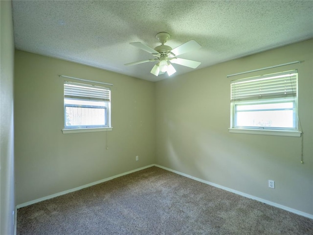 516 SW 63rd Ter, Oklahoma City, OK 73139 - unfurnished room featuring healthy amount of natural light, carpet flooring, ceiling fan, and a textured ceiling
