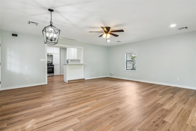 1436 NW 97th St, Oklahoma City, OK 73114 - unfurnished living room featuring ceiling fan, light wood finished floors, and recessed lighting