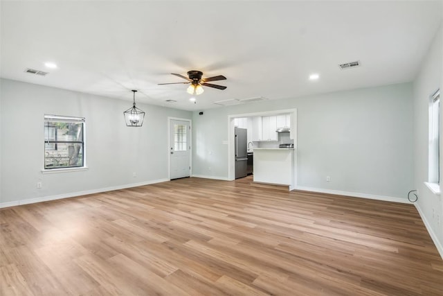 1436 NW 97th St, Oklahoma City, OK 73114 - unfurnished living room with ceiling fan, light wood-type flooring, and recessed lighting