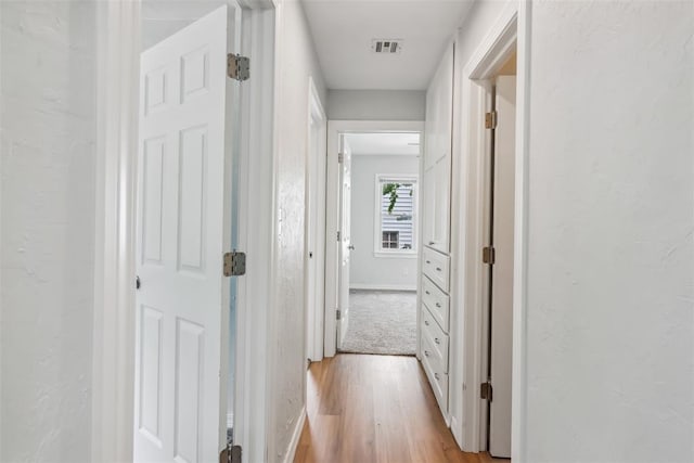 1436 NW 97th St, Oklahoma City, OK 73114 - corridor featuring light wood-style flooring and baseboards