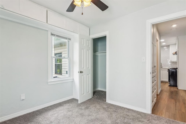 1436 NW 97th St, Oklahoma City, OK 73114 - unfurnished bedroom featuring a closet, a ceiling fan, and light carpet