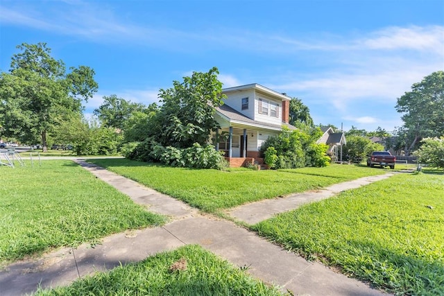 400 E Wagner Ave, Pauls Valley, OK 73075 - view of side of property featuring a lawn and a porch