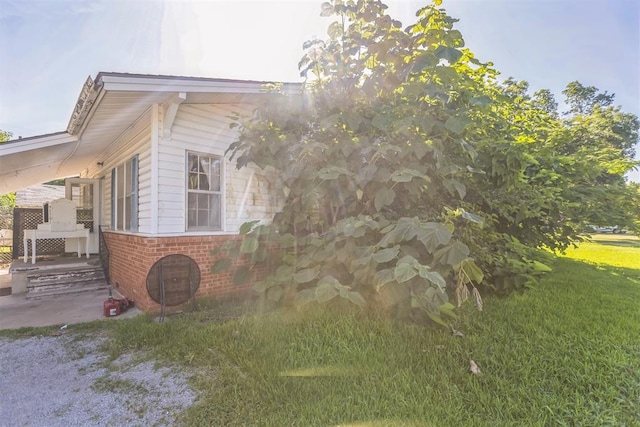 400 E Wagner Ave, Pauls Valley, OK 73075 - view of side of property with a yard and brick siding