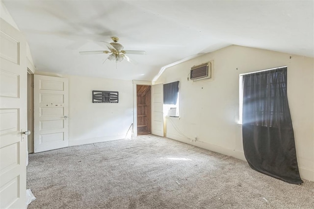 400 E Wagner Ave, Pauls Valley, OK 73075 - empty room featuring lofted ceiling, a wall unit AC, carpet floors, and a ceiling fan