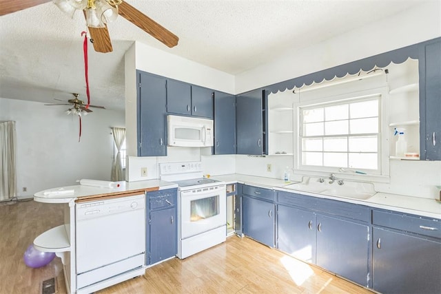 400 E Wagner Ave, Pauls Valley, OK 73075 - kitchen with white appliances, a ceiling fan, open shelves, light wood finished floors, and a textured ceiling