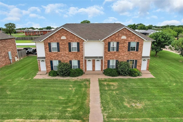 1501 N Wade St, Sayre, OK 73662 - view of front of property with brick siding, a front lawn, and a shingled roof