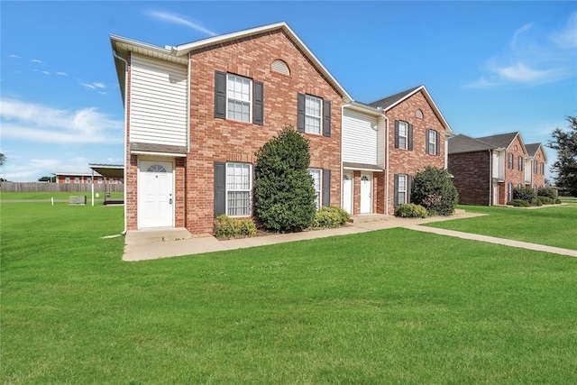 1501 N Wade St, Sayre, OK 73662 - view of front of house with a front yard and brick siding