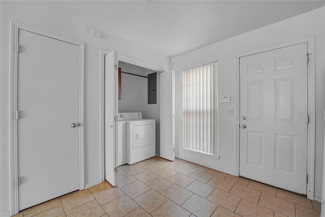 1501 N Wade St, Sayre, OK 73662 - washroom featuring washing machine and clothes dryer, light tile patterned floors, and electric panel