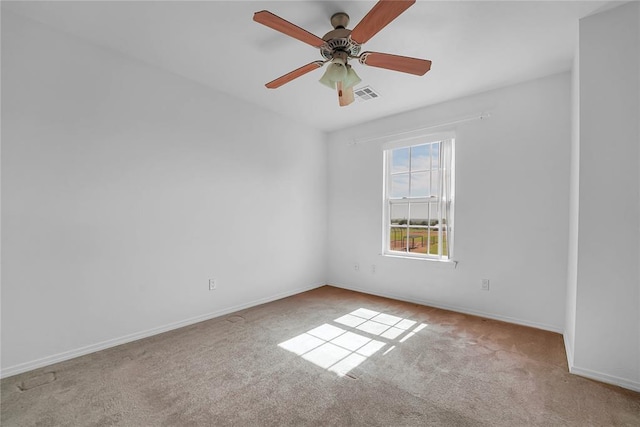 1501 N Wade St, Sayre, OK 73662 - empty room featuring carpet flooring and ceiling fan