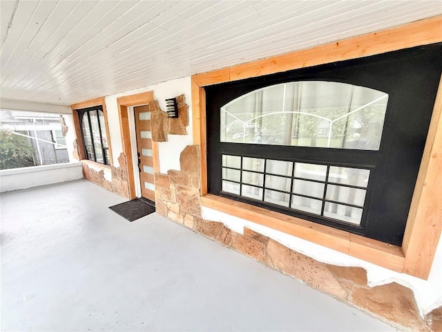 717 E Walnut St, Altus, OK 73521 - doorway to property featuring stone siding