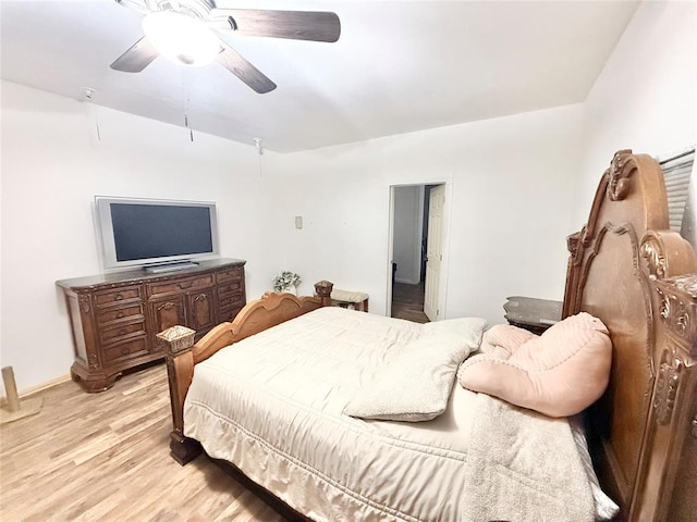 717 E Walnut St, Altus, OK 73521 - bedroom with light wood-type flooring and ceiling fan