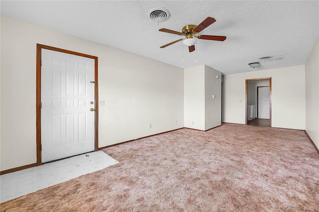 418 N Electra St, Sayre, OK 73662 - carpeted spare room featuring ceiling fan and a textured ceiling