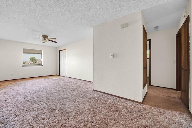 418 N Electra St, Sayre, OK 73662 - unfurnished room featuring carpet flooring, ceiling fan, and a textured ceiling