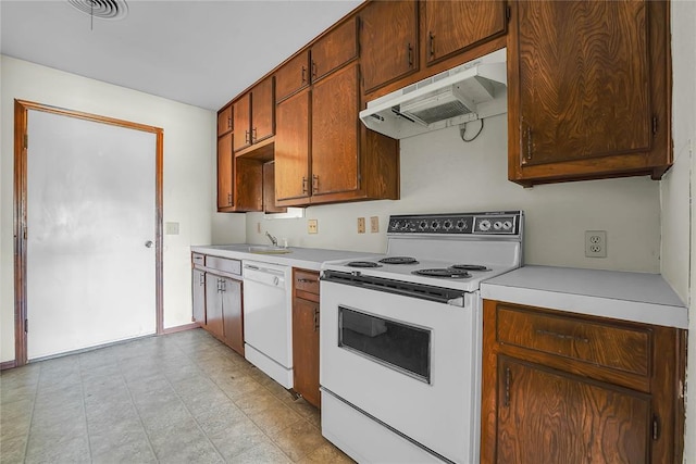 418 N Electra St, Sayre, OK 73662 - kitchen featuring white appliances, under cabinet range hood, and light countertops