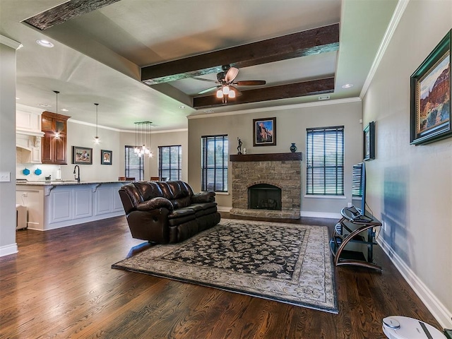 12105 SW 45th Ter, Mustang, OK 73064 - living room with dark wood-type flooring, ornamental molding, ceiling fan, beam ceiling, and a fireplace