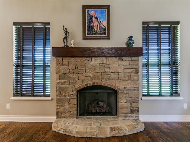 12105 SW 45th Ter, Mustang, OK 73064 - detailed view of wood finished floors and a stone fireplace