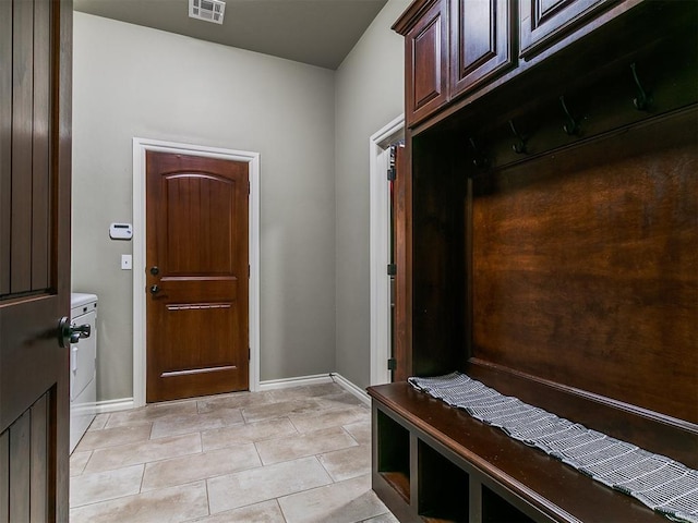 12105 SW 45th Ter, Mustang, OK 73064 - mudroom featuring baseboards and light tile patterned flooring
