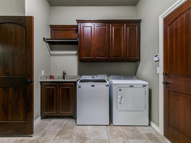 12105 SW 45th Ter, Mustang, OK 73064 - laundry room featuring cabinet space, separate washer and dryer, and light tile patterned flooring
