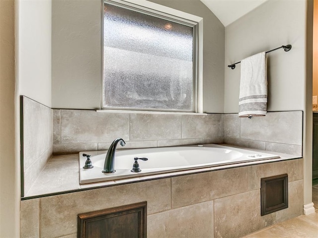 12105 SW 45th Ter, Mustang, OK 73064 - bathroom with a garden tub and vaulted ceiling