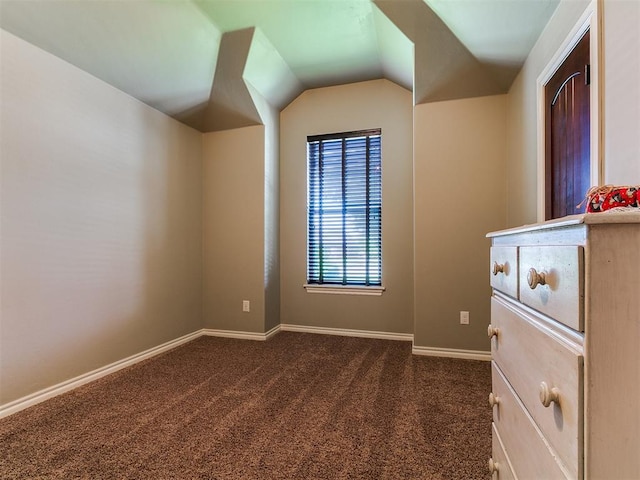12105 SW 45th Ter, Mustang, OK 73064 - additional living space with dark carpet and vaulted ceiling