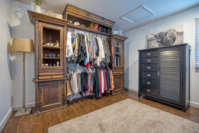 605 S Cimarron St, Hennessey, OK 73742 - spacious closet featuring attic access and wood finished floors