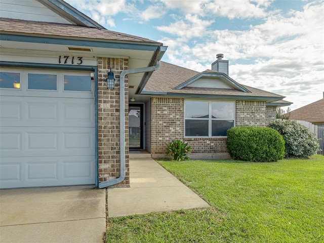 1713 SE 14th St, Moore, OK 73160 - doorway to property with a garage, a lawn, a chimney, brick siding, and roof with shingles
