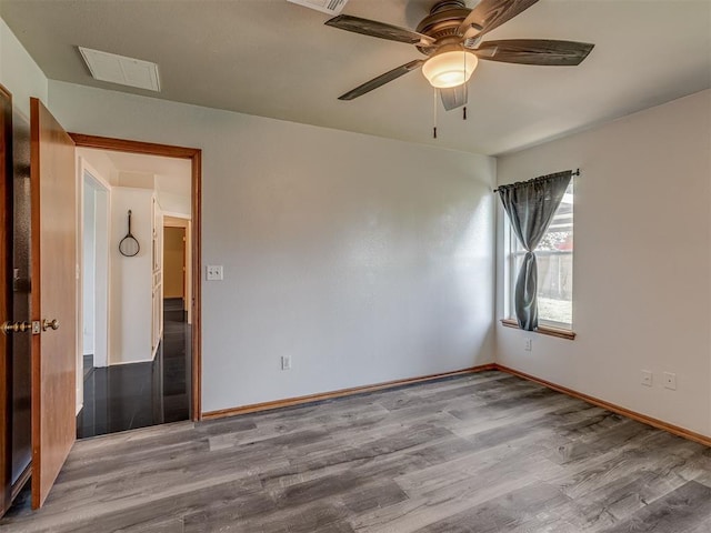 1713 SE 14th St, Moore, OK 73160 - empty room featuring wood finished floors and a ceiling fan