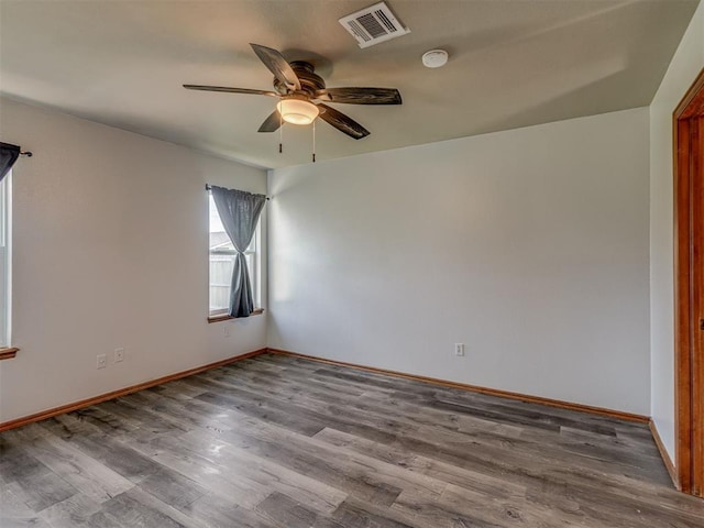1713 SE 14th St, Moore, OK 73160 - unfurnished room with a ceiling fan, wood finished floors, and a smoke detector