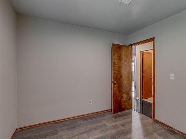 1713 SE 14th St, Moore, OK 73160 - unfurnished room featuring wood finished floors and baseboards