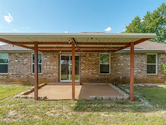 1713 SE 14th St, Moore, OK 73160 - rear view of property with a patio area and brick siding