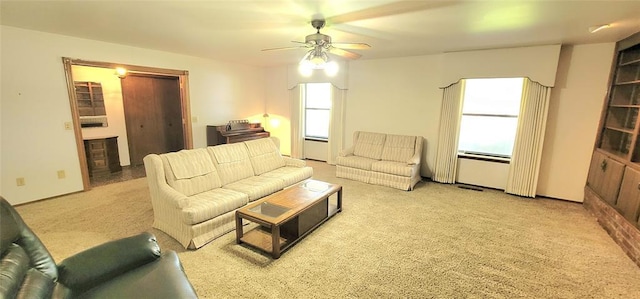 1117 Moose St, Yukon, OK 73099 - living area with a ceiling fan and light colored carpet