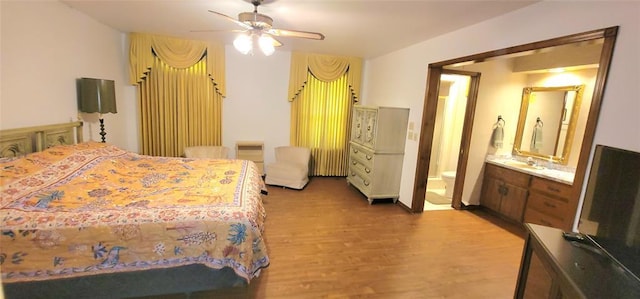 1117 Moose St, Yukon, OK 73099 - bedroom with light wood-style floors, ensuite bath, and a ceiling fan