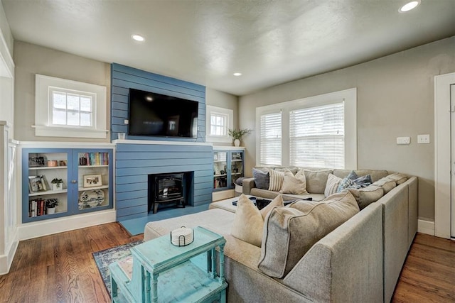 2233 W Eubanks St, Oklahoma City, OK 73112 - living area with wood finished floors, recessed lighting, and a wood stove