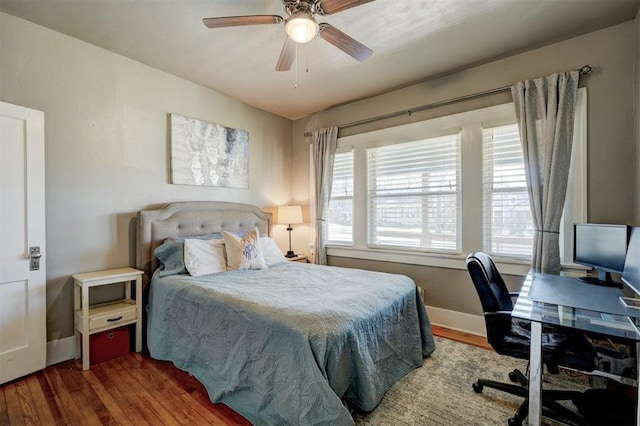 2233 W Eubanks St, Oklahoma City, OK 73112 - bedroom with wood finished floors, a desk, and a ceiling fan