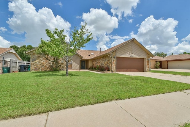 3121 SW 128th St, Oklahoma City, OK 73170 - view of front facade with stone siding, an attached garage, and concrete driveway