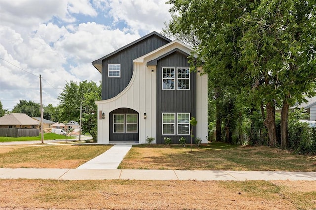 1432 NE Euclid St, Oklahoma City, OK 73117 - view of front of property featuring a front yard and board and batten siding