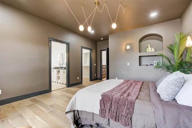 1432 NE Euclid St, Oklahoma City, OK 73117 - bedroom featuring light wood finished floors and connected bathroom