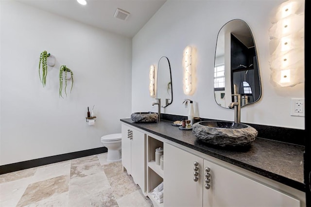 1432 NE Euclid St, Oklahoma City, OK 73117 - full bathroom with double vanity and toilet
