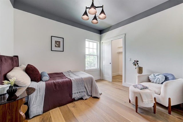1432 NE Euclid St, Oklahoma City, OK 73117 - bedroom featuring a chandelier, a closet, and light wood finished floors