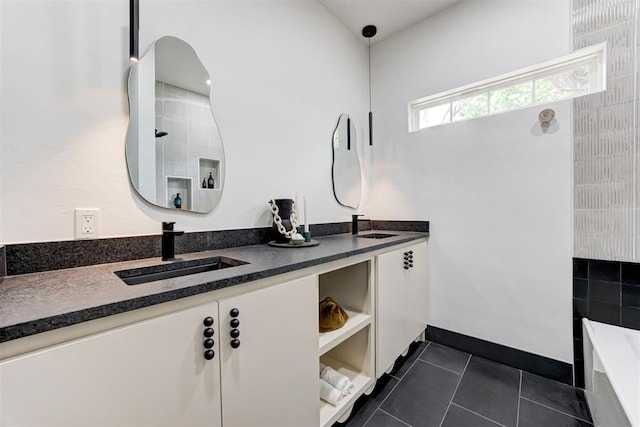 1432 NE Euclid St, Oklahoma City, OK 73117 - bathroom featuring double vanity, a bath, tile patterned floors, and tiled shower
