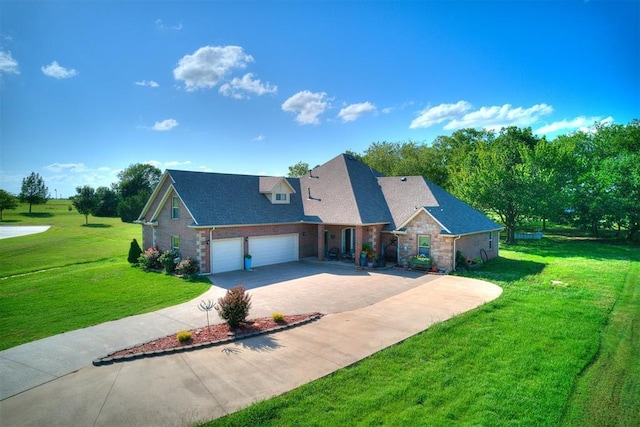 73 Sonata Ln, Shawnee, OK 74804 - view of front of home featuring a front yard, driveway, a garage, a shingled roof, and stone siding