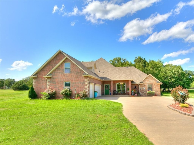 73 Sonata Ln, Shawnee, OK 74804 - traditional-style house with driveway, a front lawn, brick siding, and an attached garage
