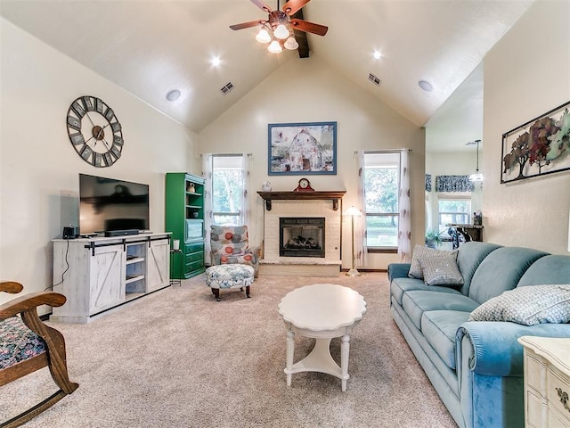 73 Sonata Ln, Shawnee, OK 74804 - carpeted living room featuring a ceiling fan, plenty of natural light, high vaulted ceiling, and a fireplace