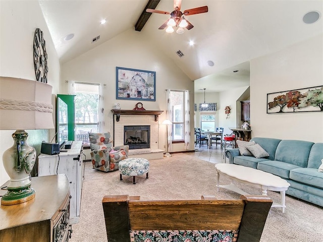 73 Sonata Ln, Shawnee, OK 74804 - living room with high vaulted ceiling, beamed ceiling, ceiling fan, light colored carpet, and plenty of natural light