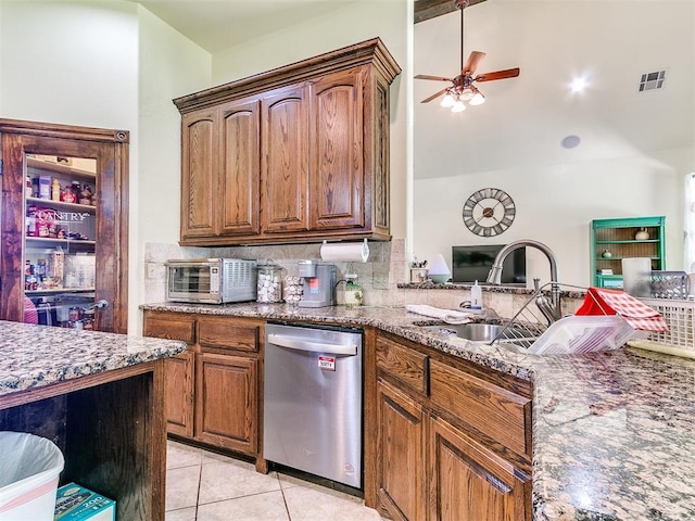 73 Sonata Ln, Shawnee, OK 74804 - kitchen with dishwasher, a ceiling fan, dark stone counters, and light tile patterned flooring