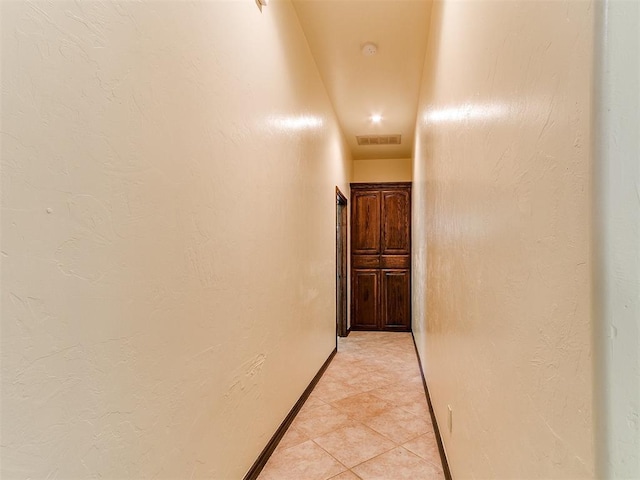 73 Sonata Ln, Shawnee, OK 74804 - hallway featuring light tile patterned flooring and baseboards